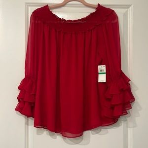 CeCe top-not worn.  Tag removed to clean before trying on